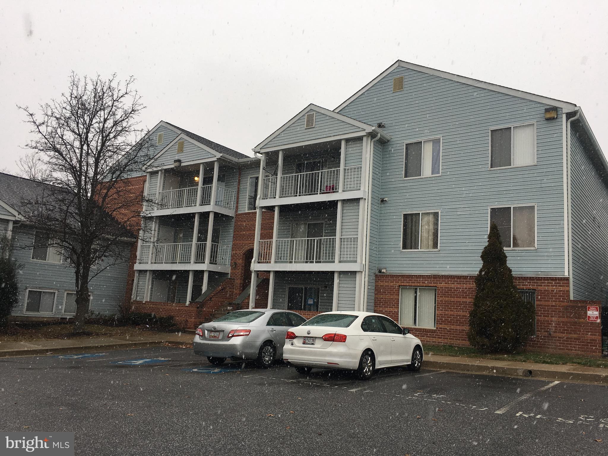6708 Ridge Road, Unit 102 Baltimore, MD 21237 - Photo 1 of 14 a view of multiple houses with a street