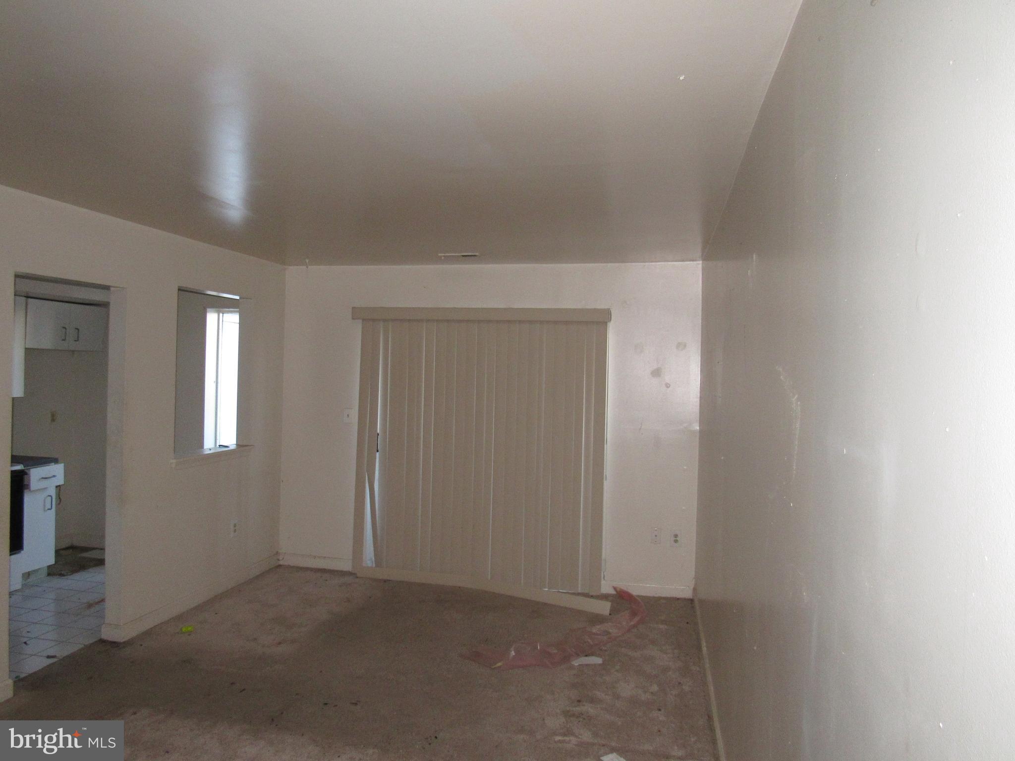 6708 Ridge Road, Unit 102 Baltimore, MD 21237 - Photo 2 of 14 an empty room with windows