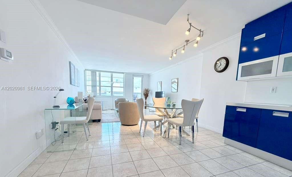100 Lincoln Road, Unit 1423 Miami Beach, FL 33139 - Photo 2 of 17 a view of a dining room with furniture and chandelier