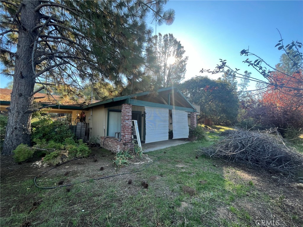 3877 Deer Springs Road Mariposa, CA 95338 - Photo 1 of 1 a backyard of a house with lots of green space