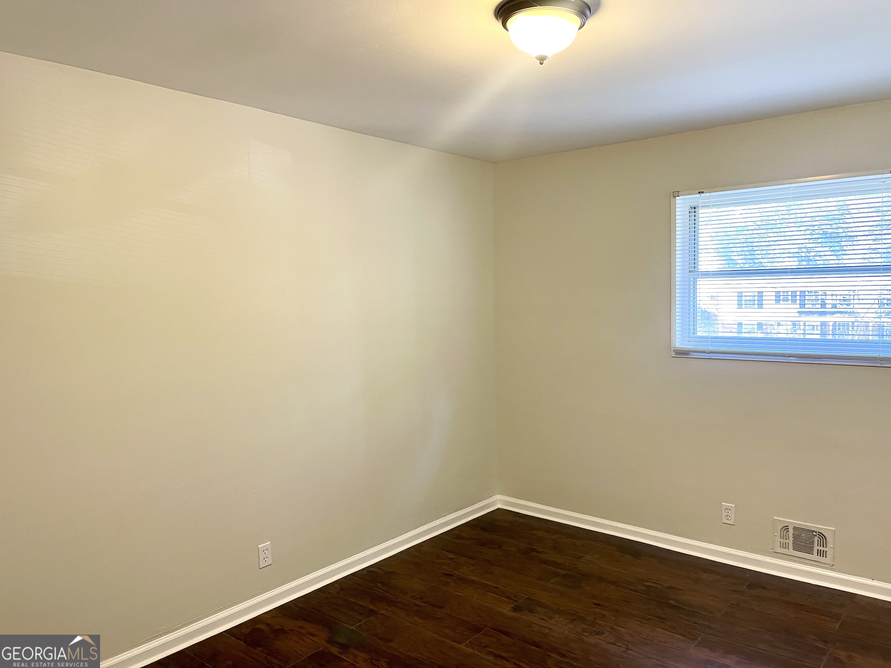 5435 Winstead Court Southwest South Fulton, GA 30349 - Photo 12 of 20 a view of a small space with wooden floor and a window