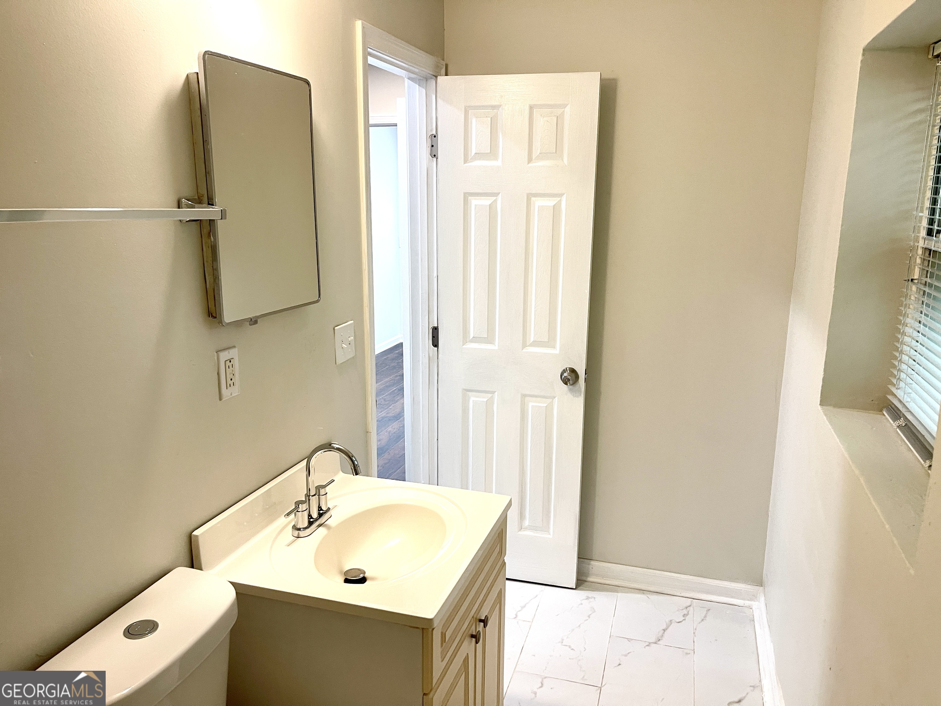 5435 Winstead Court Southwest South Fulton, GA 30349 - Photo 16 of 20 a bathroom with a sink and mirror