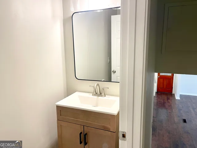 a bathroom with a sink and a mirror