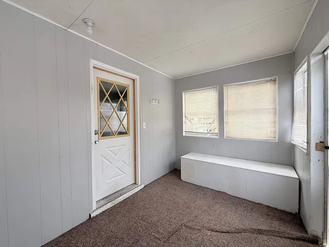 a view of a house with a snow in the yard