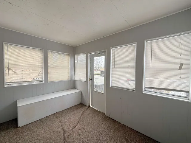 a view of a house with a snow in the yard