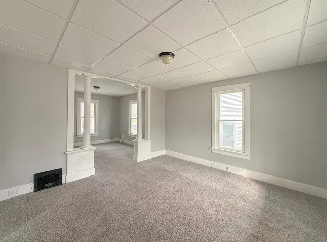 a view of an empty room with a window