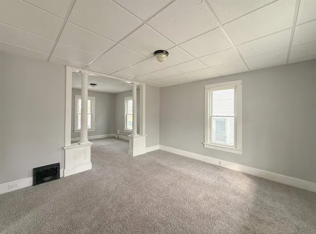 a view of an empty room with a window