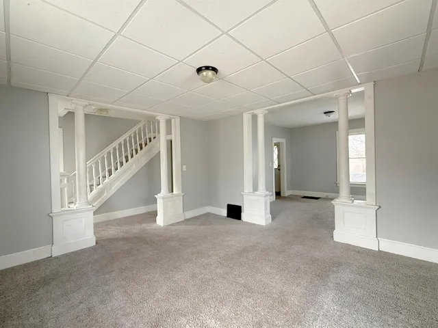 a view of an empty room with stairs