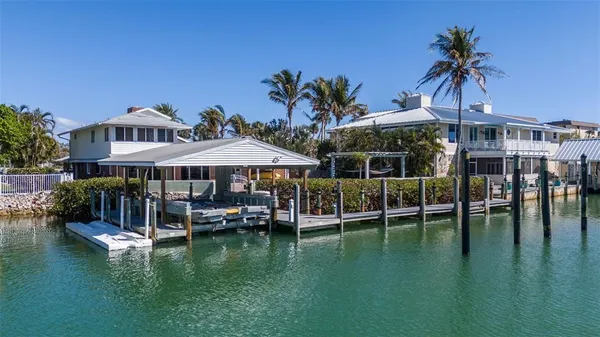 a view of a swimming pool with a table and chairs