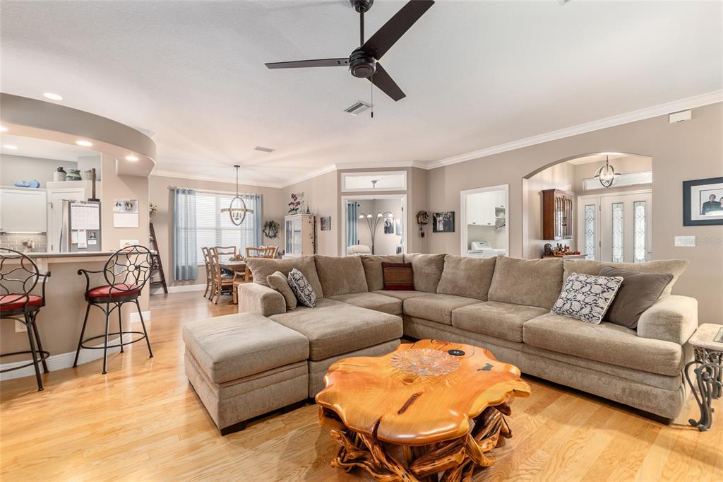 16116 Southwest 15th Court Ocala, FL 34473 - Photo 29 of 81 a living room with furniture and a view of kitchen