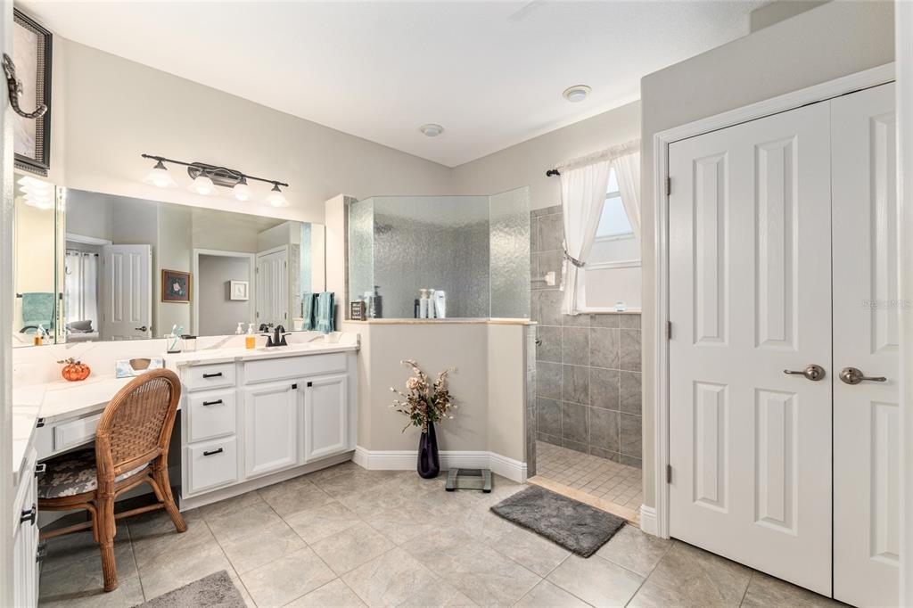 16116 Southwest 15th Court Ocala, FL 34473 - Photo 52 of 81 a bathroom with a double vanity sink mirror and shower