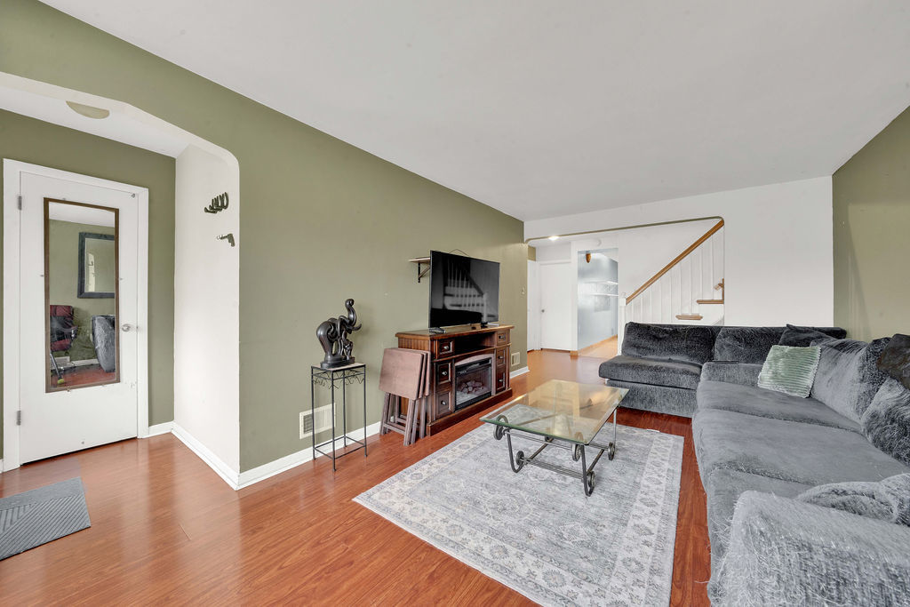 7234 South Ridgeway Avenue Chicago, IL 60629 - Photo 2 of 27 a living room with furniture and a flat screen tv