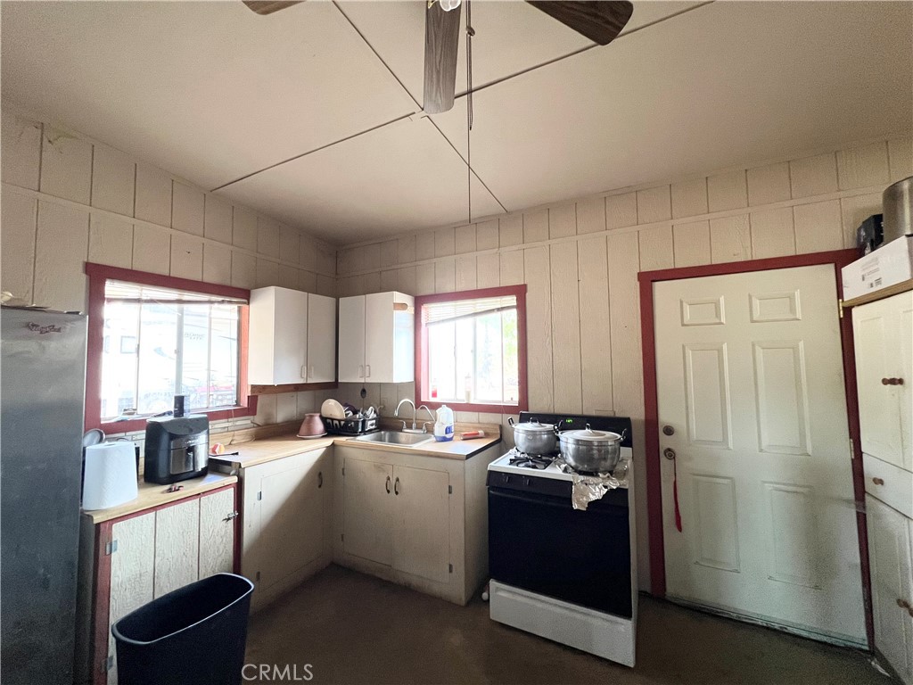 45080 Terwilliger Road Anza, CA 92539 - Photo 16 of 45 a kitchen with a sink appliances and cabinets