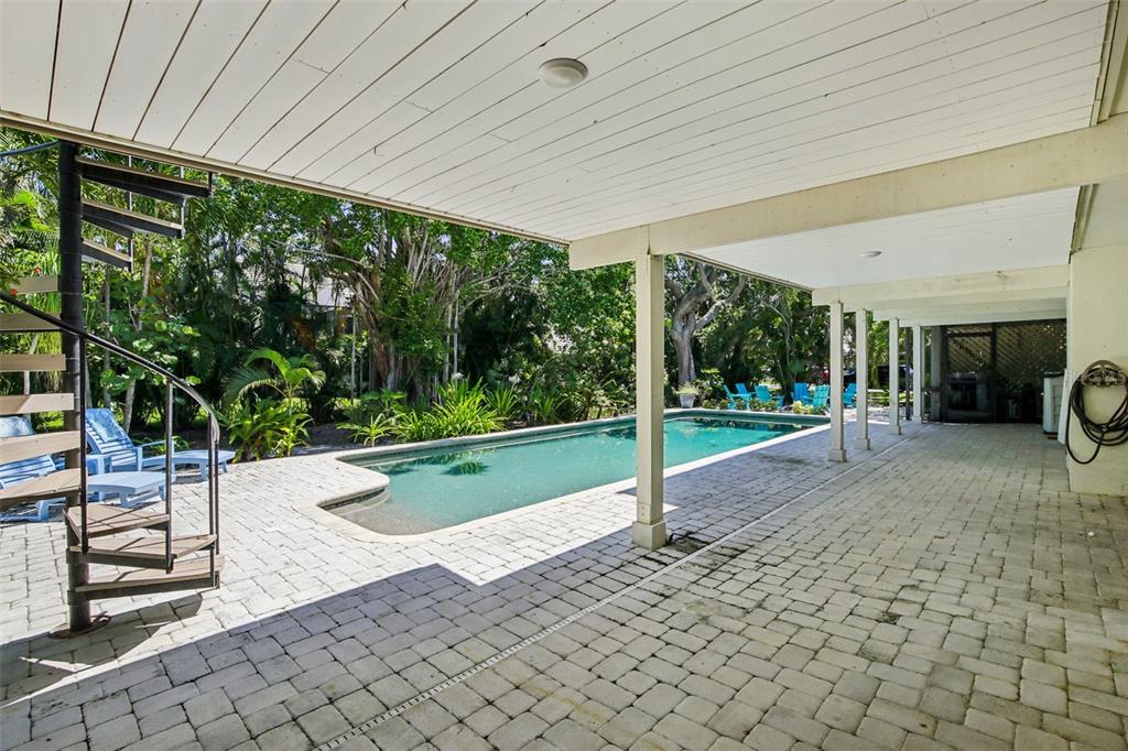 3390 Bayou Sound Longboat Key, FL 34228 - Photo 41 of 59 a view of a porch with furniture and garden