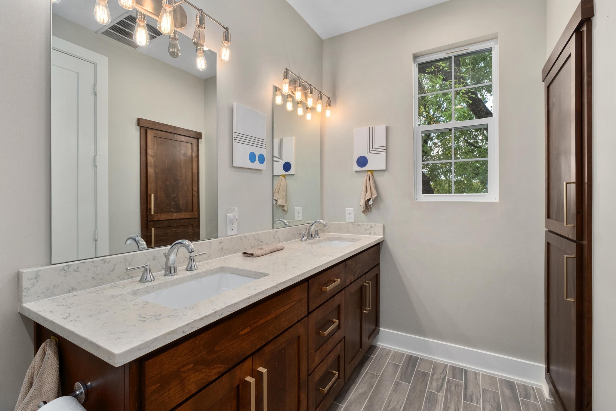 3302 Funston Street Austin, TX 78703 - Photo 24 of 36 Full bath with double vanity and wood tiled floors