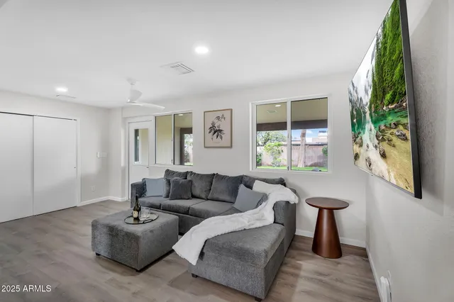 a living room with furniture and a large window