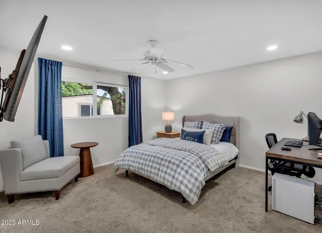 a bedroom with a bed and a couch