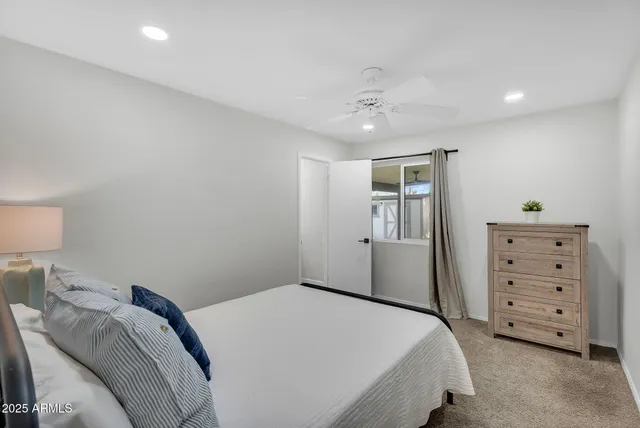 a bedroom with a bed and a cabinets