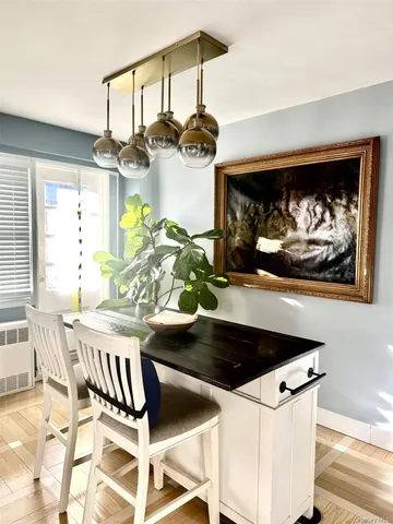 a dining room with furniture and chandelier