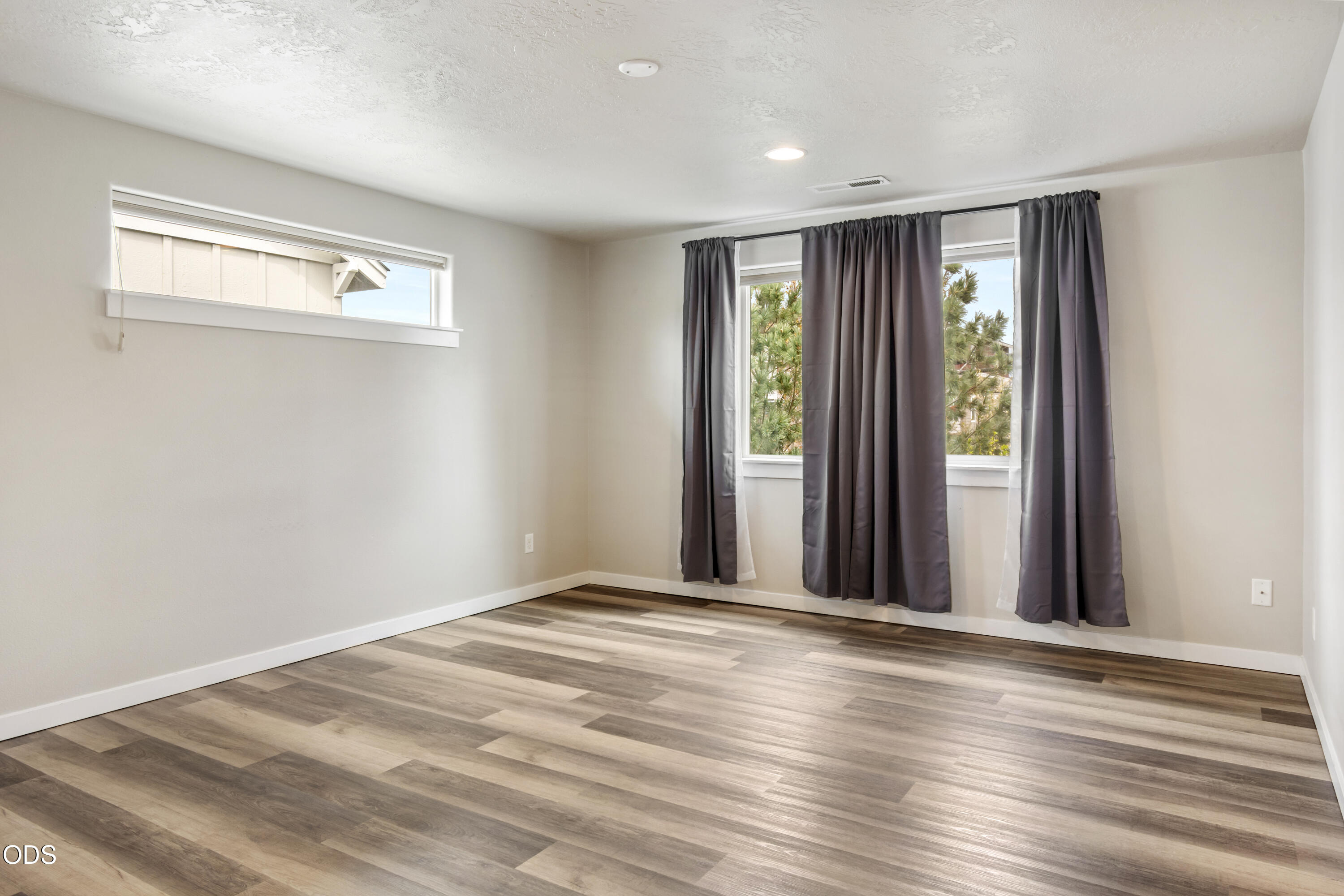 21332 Oconnor Way Bend, OR 97701 - Photo 6 of 33 a view of an empty room with wooden floor