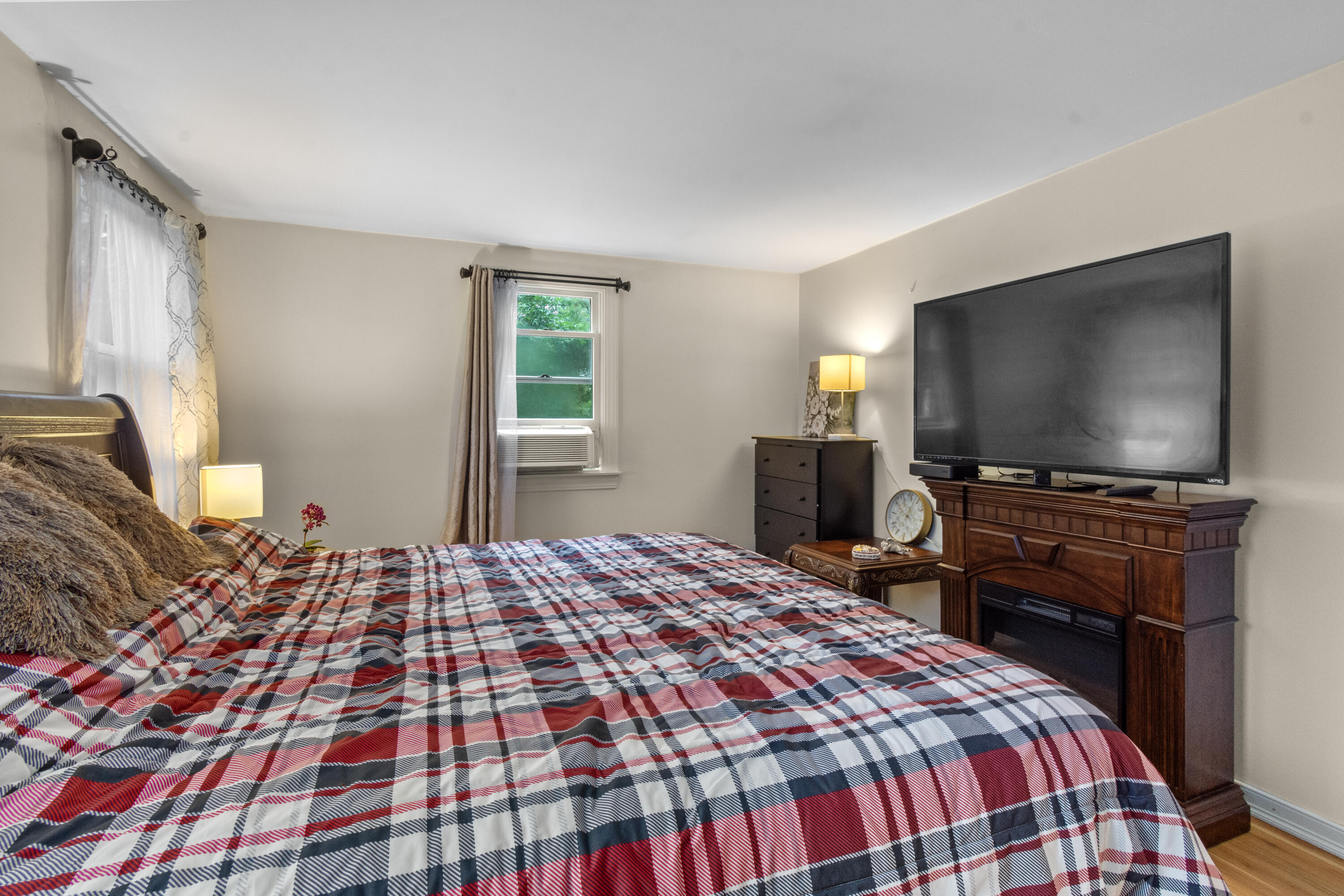 30 Patience Lane Cotuit, MA 02635 - Photo 11 of 27 a bedroom with a bed and a flat screen tv