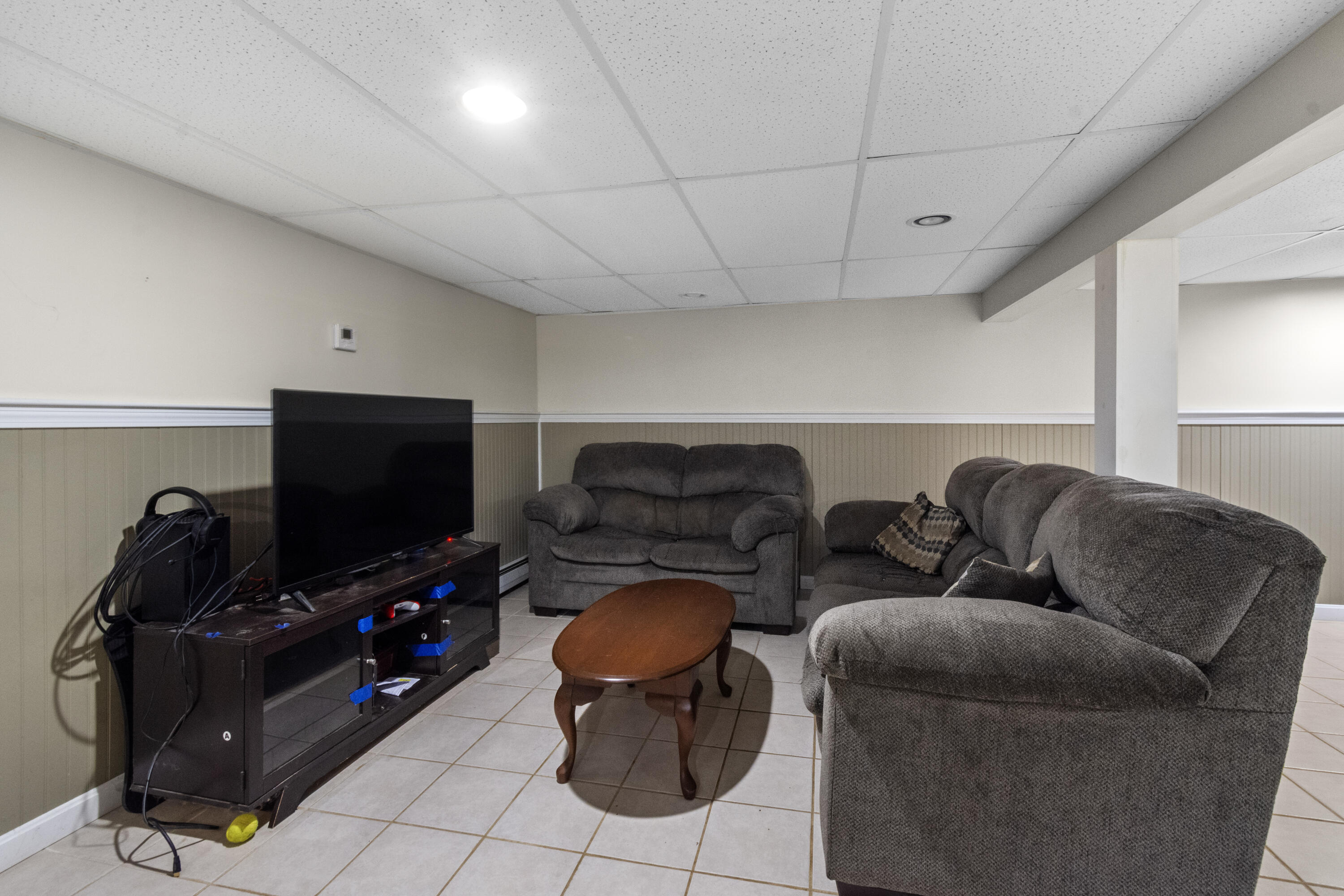 30 Patience Lane Cotuit, MA 02635 - Photo 15 of 27 a living room with furniture and a flat screen tv