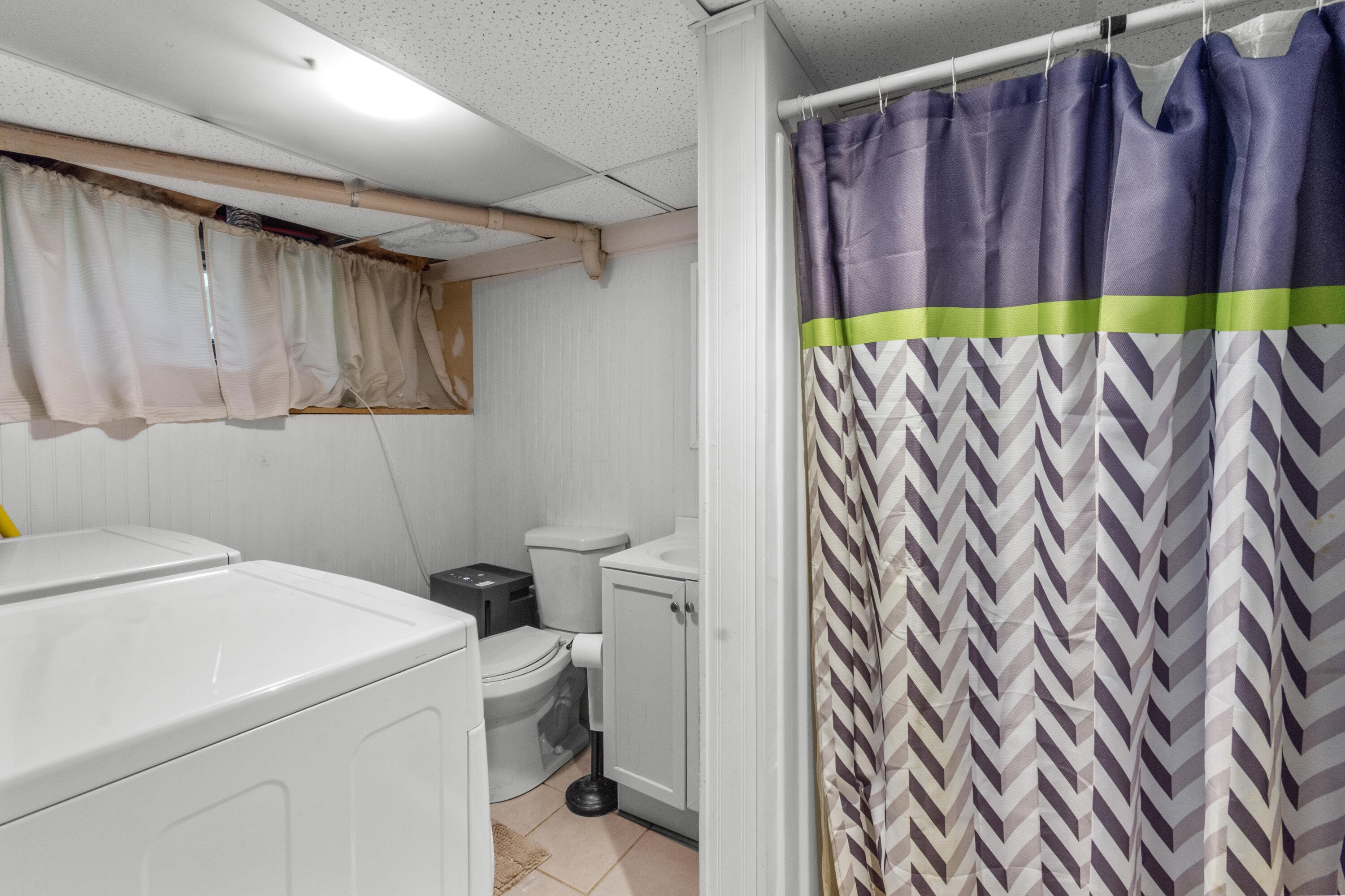 30 Patience Lane Cotuit, MA 02635 - Photo 18 of 27 a bathroom with a sink a toilet and a shower curtain