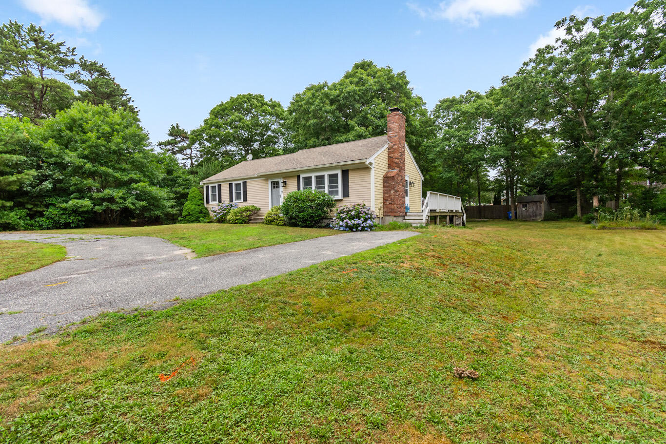 30 Patience Lane Cotuit, MA 02635 - Photo 2 of 27 a view of a house with a yard and palm trees