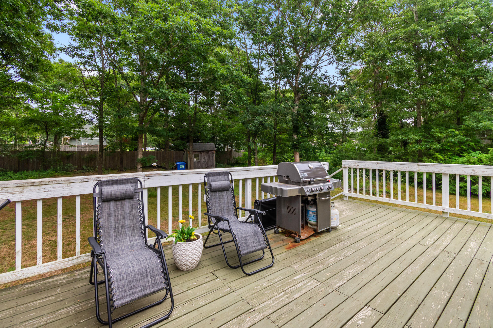 30 Patience Lane Cotuit, MA 02635 - Photo 21 of 27 a view of a deck with chairs and wooden floor