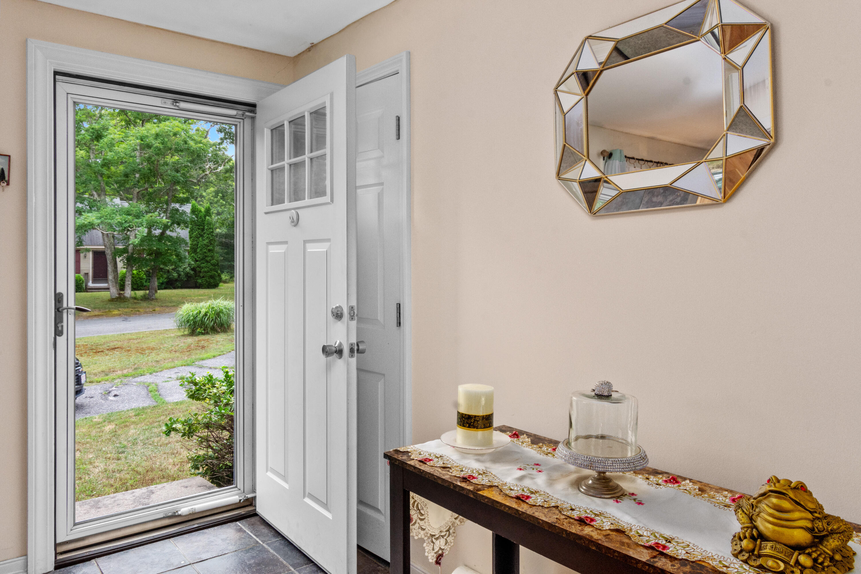 30 Patience Lane Cotuit, MA 02635 - Photo 3 of 27 a bathroom with a granite countertop sink and a mirror