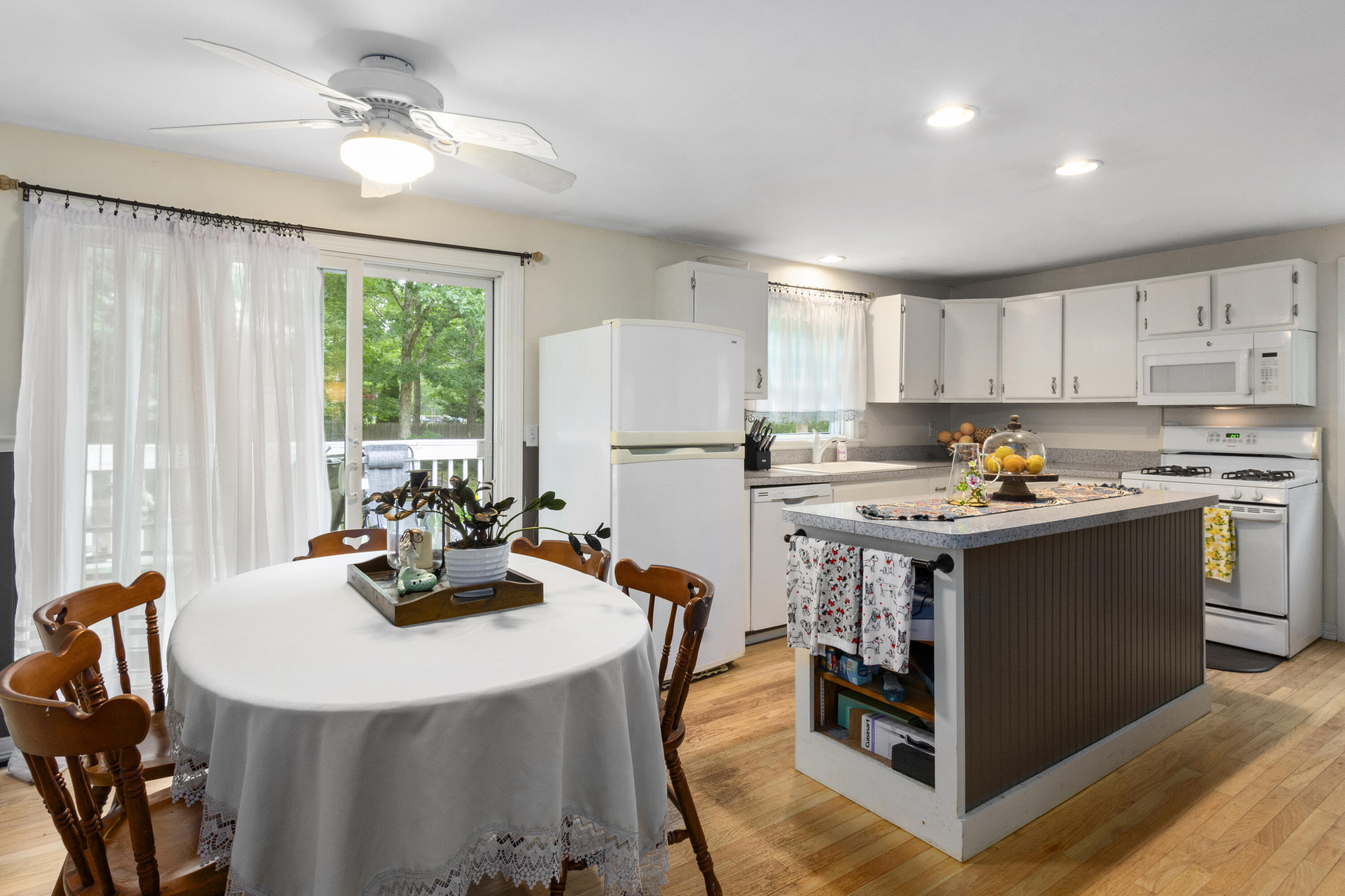 30 Patience Lane Cotuit, MA 02635 - Photo 6 of 27 a kitchen with stainless steel appliances granite countertop a stove refrigerator sink and cabinets