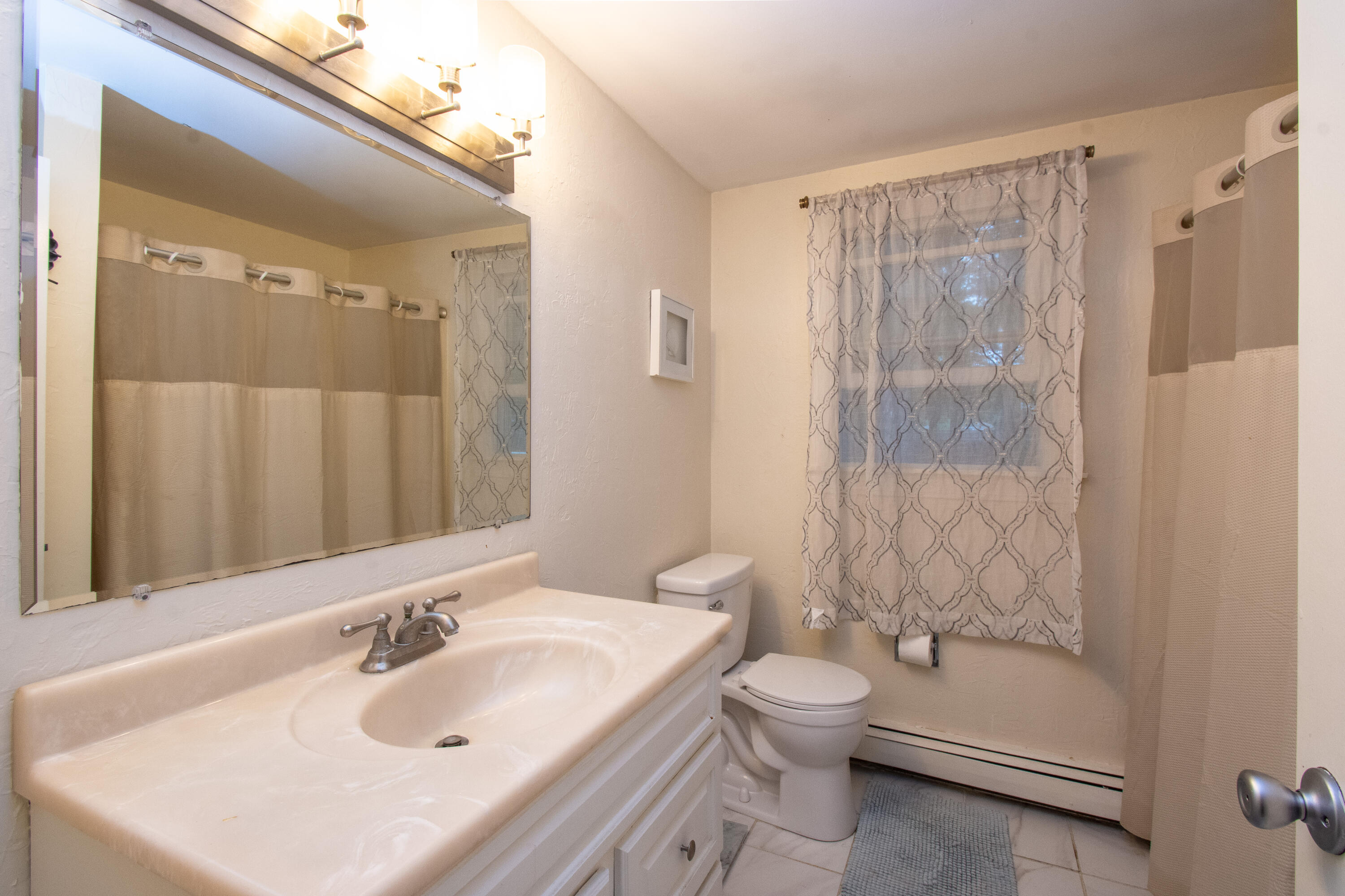 30 Patience Lane Cotuit, MA 02635 - Photo 9 of 27 a bathroom with a sink toilet and shower