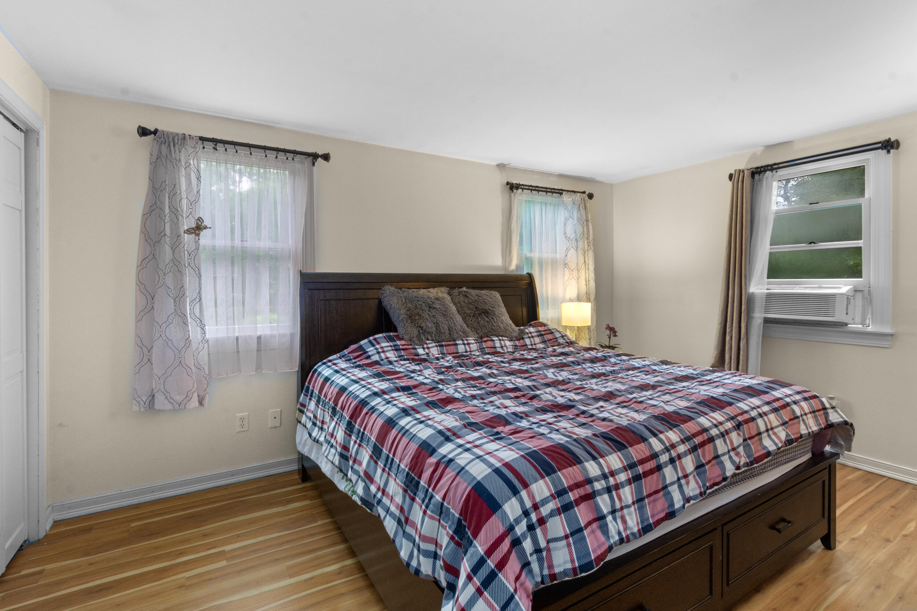 30 Patience Lane Cotuit, MA 02635 - Photo 10 of 27 a bedroom with a bed and wooden floor