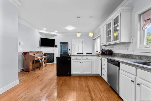 a kitchen with stove a sink and a microwave