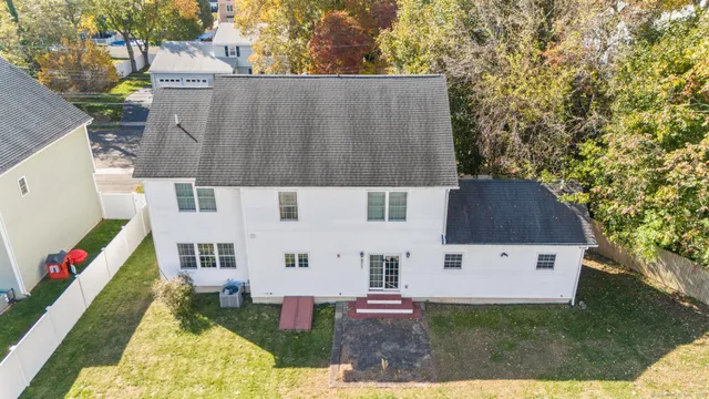 a aerial view of a house with a yard