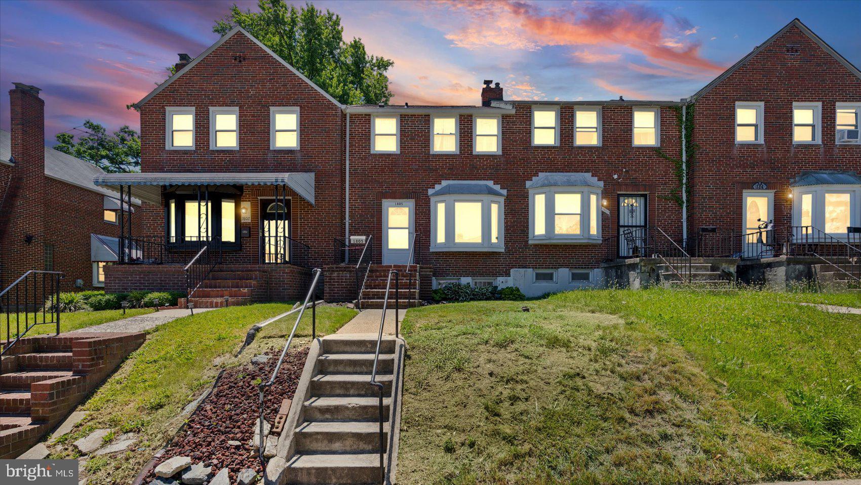 1805 Crestview Road Baltimore, MD 21239 - Photo 2 of 39 a front view of a residential apartment building with a yard