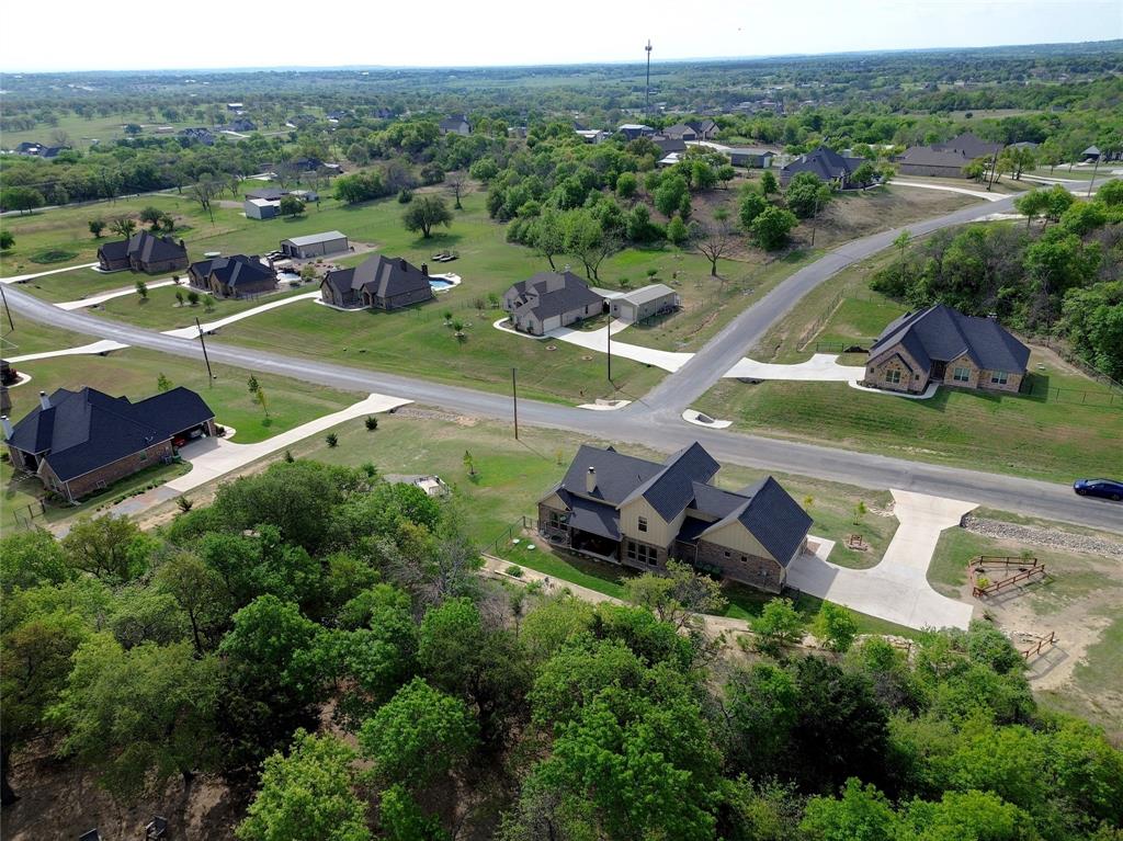1024 Tex Lane Springtown, TX 76082 - Photo 5 of 40 an aerial view of a house with a garden