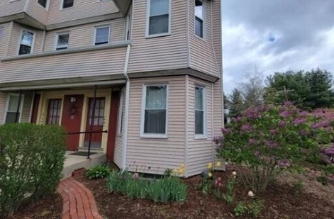 2 Sherman Street, Unit 2A3 Cambridge, MA 02138 - Photo 15 of 18 a view of a house with more windows and plants