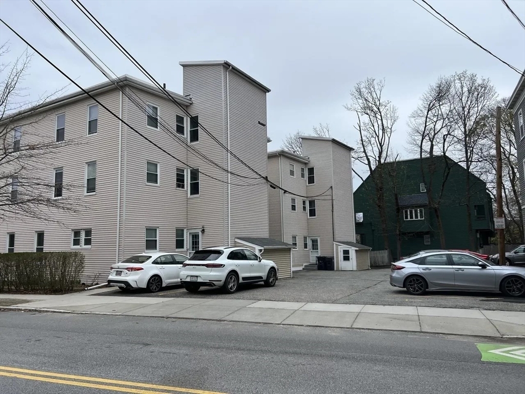 2 Sherman Street, Unit 2A3 Cambridge, MA 02138 - Photo 17 of 18 a car parked in front of a white building