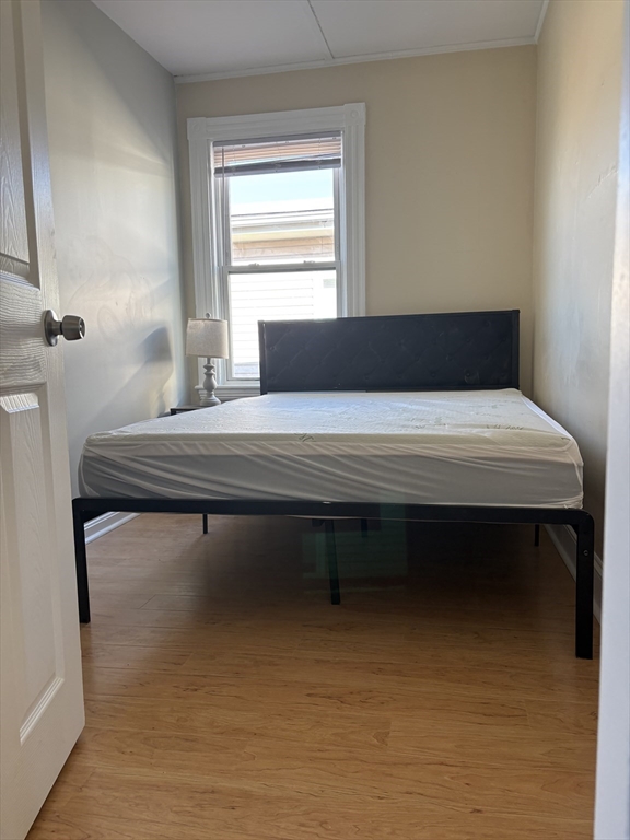 2 Sherman Street, Unit 2A3 Cambridge, MA 02138 - Photo 5 of 18 a room with a table and window