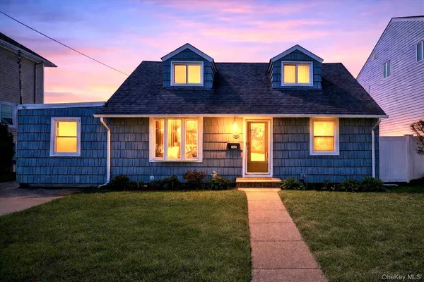 a front view of a house with yard