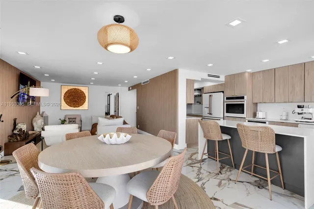 a kitchen with a table and chairs in it