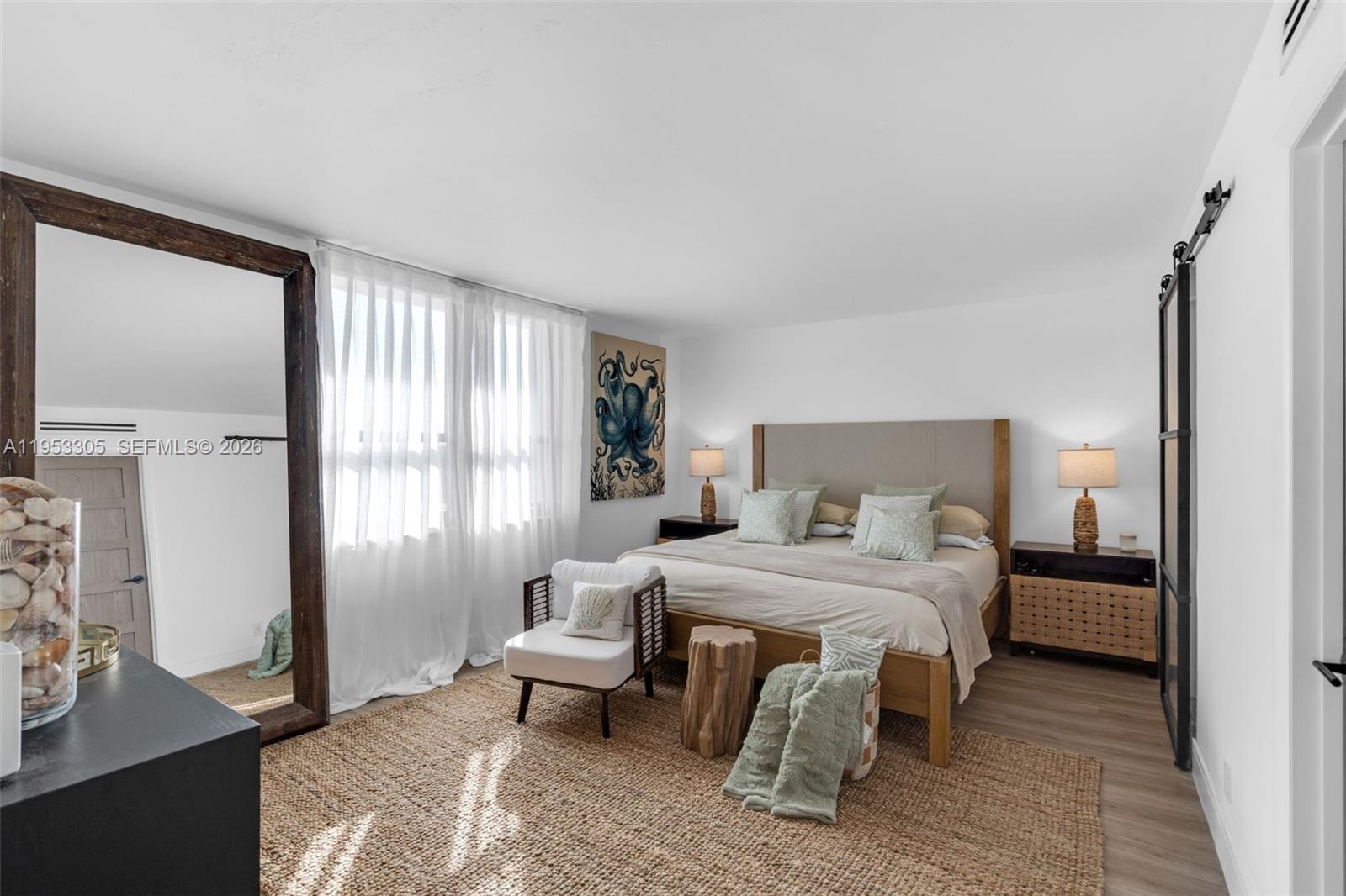 5480 North Ocean Drive, Unit B1B Singer Island, FL 33404 - Photo 21 of 41 a bedroom with a bed and a couch