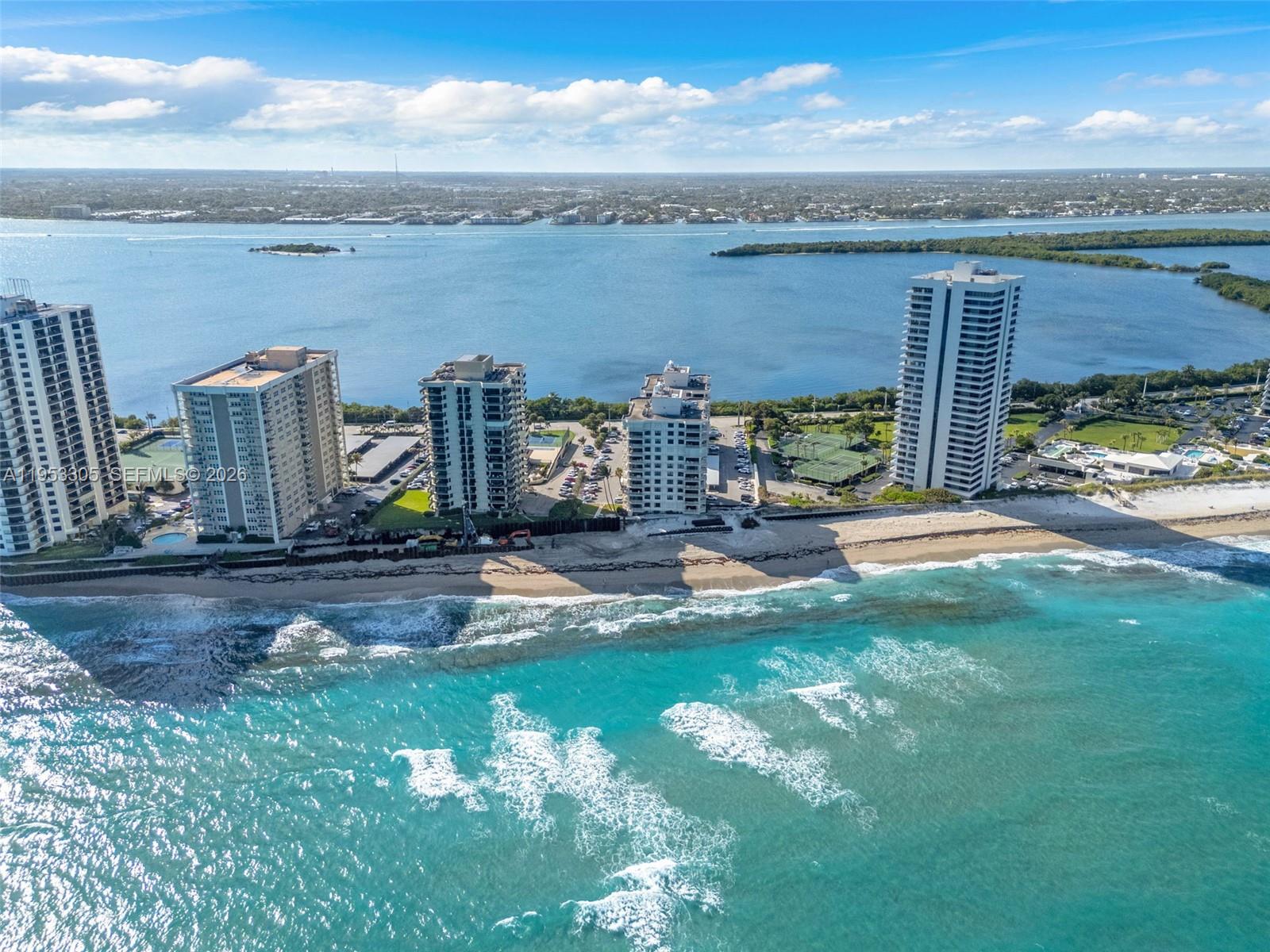 5480 North Ocean Drive, Unit B1B Singer Island, FL 33404 - Photo 26 of 41 a view of a lake with a yard and potted plants