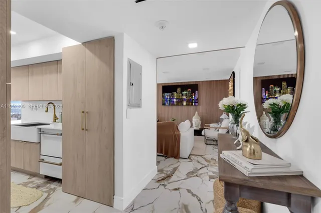 a view of living room filled with furniture and wooden floor