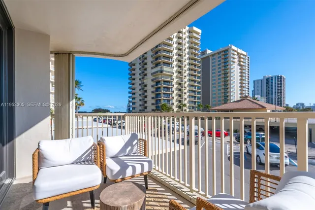 a view of a balcony with chairs