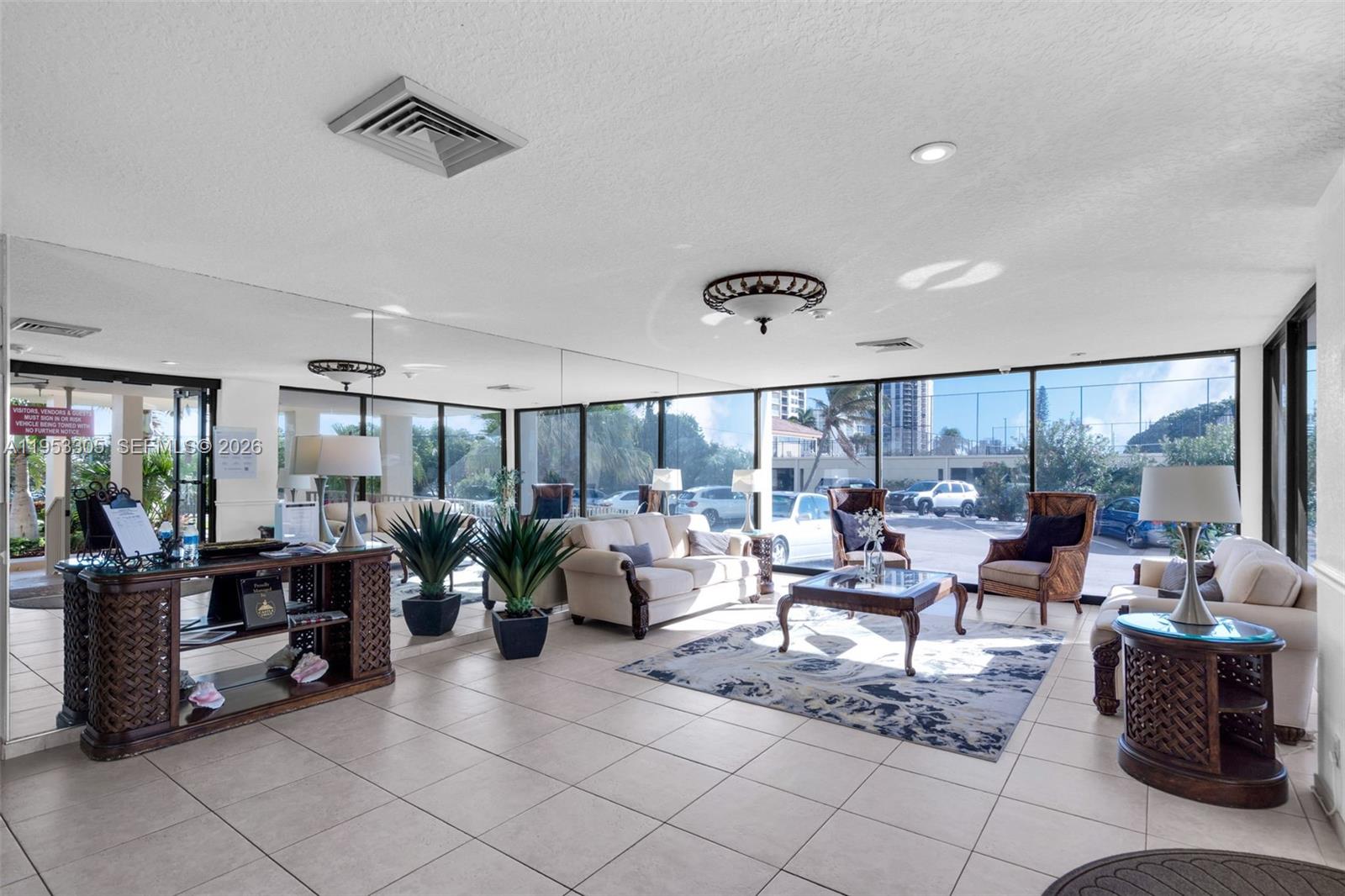 5480 North Ocean Drive, Unit B1B Singer Island, FL 33404 - Photo 40 of 41 a living room with furniture and a large window