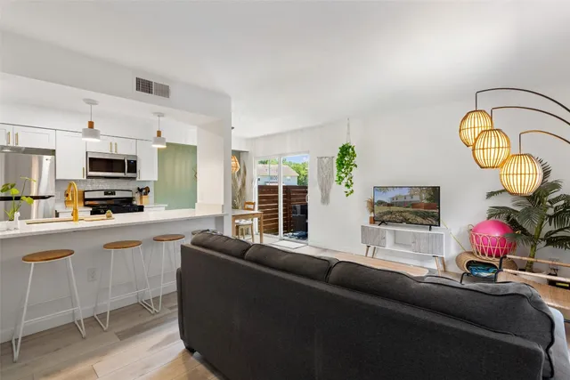 a living room with furniture gym equipment and a fireplace