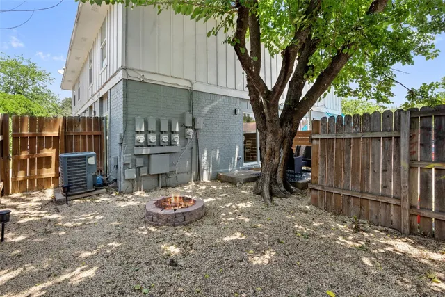 a backyard of a house with barbeque oven