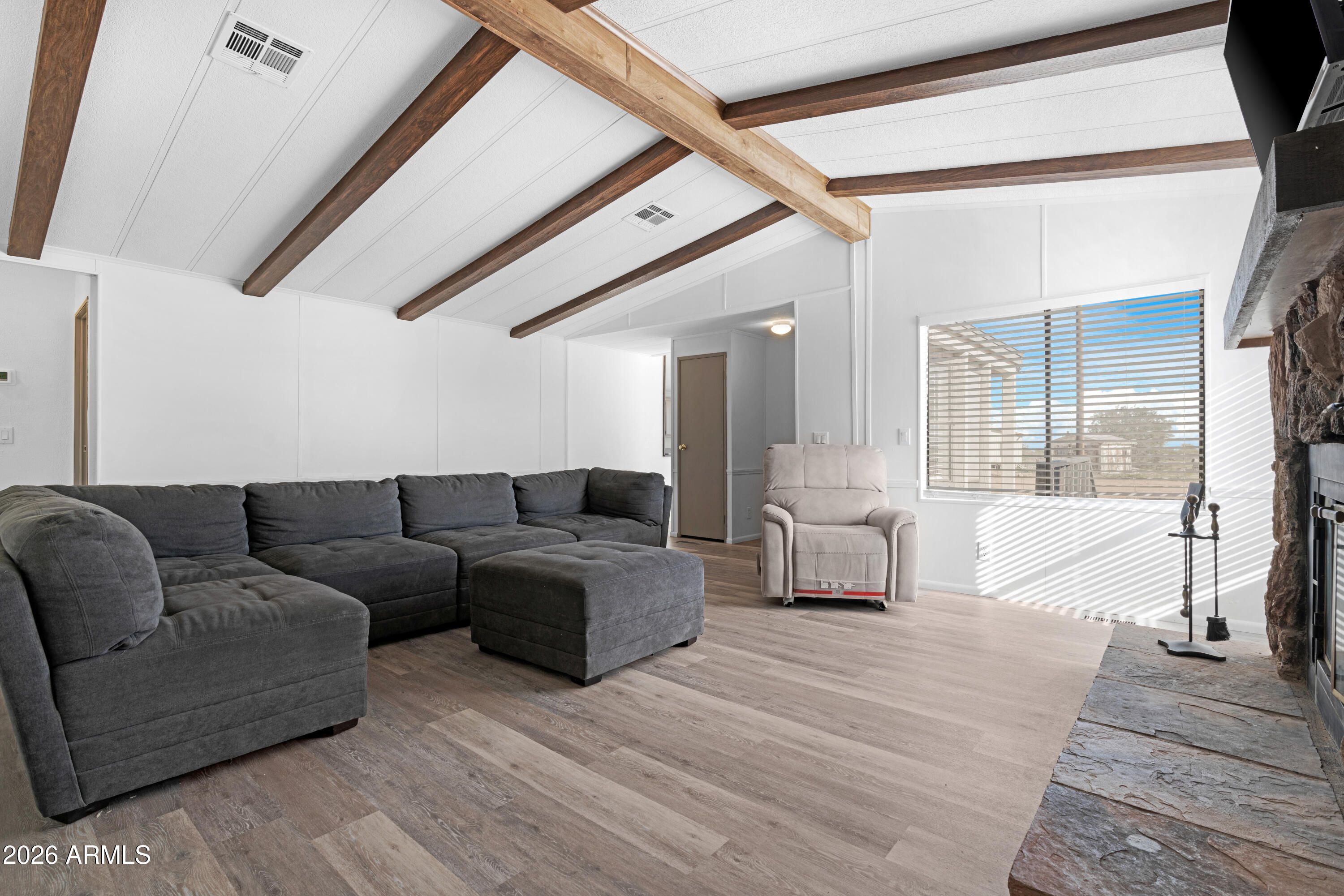 53925 West Stallion Road Maricopa, AZ 85139 - Photo 17 of 46 a living room with furniture and a large window